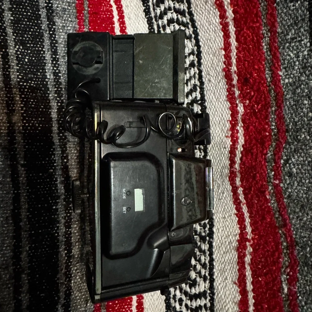Canon Black and Silver Camera with Detachable Flash